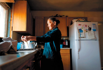 Lily Chief makes frybread in her kitchen at her home near Black Mesa, Ariz. on Thursday. Chief, who has lived 84 years without electricity, recently had electricity run to her home. — © 2009 Gallup Independent / Brian Leddy 