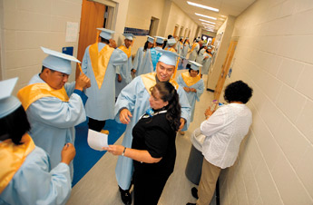 Laguna-Acoma seniors crowd the halls lining up for graduation on Saturday in Casa Blanca, New Mexico. — © 2009 Gallup Independent / Adron Gardner 