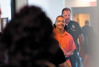 Robert Kiro is photographed while being escorted from court after a hearing to reduce his sentence Thursday. — © 2009 Gallup Independent / Adron Gardner 