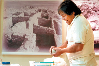 Artist Carlos Laate works the clay with his hands at the Zuni Arts Center in Zuni as part of the Ancient Way Arts Trail on Saturday. — © 2009 Gallup Independent / Adron Gardner