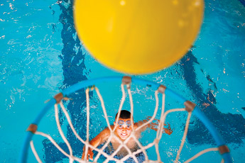 Dominik Molina watches as his basketball goes into the hoop during a Boys and Girls Club outing to the Aquatic Center Thursday. It was Molina's first day as a member of the Boys and Girls Club. — © 2009 Gallup Independent / Cable Hoover 