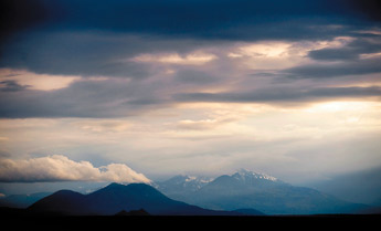 The San Francisco Peaks near Flagstaff, Ariz. loom in a shroud of rain-heavy cloud in this May 22 photo. — © 2009 Gallup Independent / Brian Leddy
