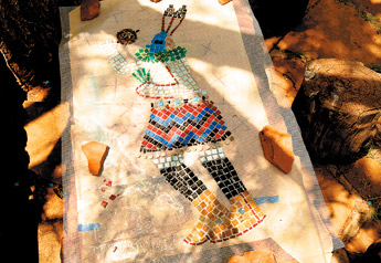 Philander Begay's yei bi cheii mosaic is almost near completion. — © 2009 Gallup Independent / Brian Leddy 