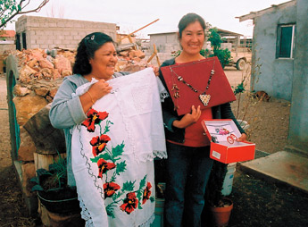 Joesfina Morales and her daughter, Carolina, displaying their handcrafts outside the Palomas co-op. Courtesy Photo 