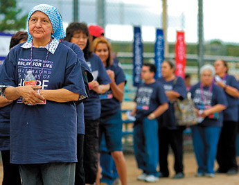 Marcella Alderete and fellow cancer survivors are recognized in the opening ceremonies for the 2009 Relay for Life at the Gallup Sports Complex on Friday. — © 2009 Gallup Independent / Adron Gardner 