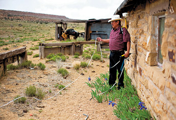 Navajo EPA employee Jerry Begay works with private contractors to measure radiation levels at the site of Larry Kings home near Churchrock. Kings home is located down wind from the old United Nuclear Company mine site. — © 2009 Gallup Independent / Brian Leddy