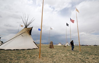 A member of the Diné Native American Church of New Mexico walks away from the teepee June 13 at the fifth Annual Diné Native American Church Conference in Coyote Canyon. — Donovan Quintero/For the Independent