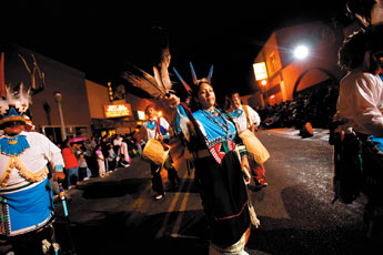 The White Eagle Dancer group from Zuni makes it's way down Coal Street during the 88th Inter-Tribal Indian Ceremonial night parade in downtown Gallup Thursday. — © 2009 Gallup Independent / Cable Hoover 