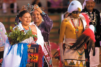 Nicole Helena James, left, receives the crown from 2008-09 Miss Inter-Tribal Indian Ceremonial Crystalyne Gayle Curley during the coronation ceremony at Red Rock Park Saturday. — © 2009 Gallup Independent / Cable Hoover 