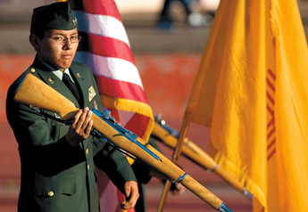 Gilford Yazzie drills before presenting flags with the color guard before Gallup and Farmington faced off for football at the Public School Stadium on Friday. — © 2009 Gallup Independent / Brian Leddy 