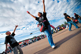 Jacob Coley, left, pleads for candy and hand outs from members of the UNM-G Parade float procession Saturday at the Navajo Nation Parade in Window Rock. — © 2009 Gallup Independent / Cable Hoover
