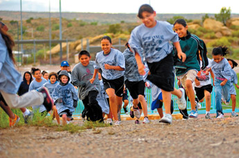 Participants run up a hill at the Sports Complex for the 2009 Fun Run at the Gallup Sports Complex on Thursday. — © 2009 Gallup Independent / Adron Gardner 