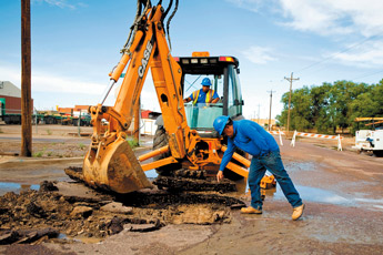 Phil Silva, the distribution supervisor for the City of Gallup, points out where to dig while looking for a water main break on Second Street near the railroad tracks on Thursday. — © 2009 Gallup Independent / Brian Leddy 