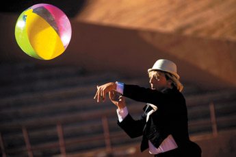 Bulgarian circus clown Tsanko Tsanov throws a beach ball to the crowd during his performance with the Jordan World Circus at Red Rock Park Thursday. — © 2009 Gallup Independent / Cable Hoover