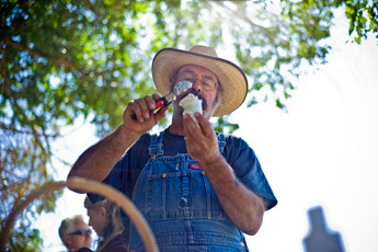 Bill Miller serves up a sample of organic ice cream at the Ramah farmer's market during the Ancient Way Festival Saturday. — © 2009 Gallup Independent / Cable Hoover
