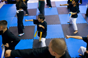 Six-year-old Sean Yazzie, center, and students practice their punches at Jody Sanchez Academy of Martial Arts Thursday. The academy recently re-located to 202 W. Coal Avenue in downtown Gallup. — © 2009 Gallup Independent / Cable Hoover