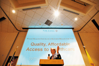 Sen. Tom Udall speaks to a crowd at the University of New Mexico-Gallup on Monday during a town hall meeting on health care reform. "Today folks, we run not a health care system, but a sick care system," Udall said. — © 2009 Gallup Independent / Brian Leddy 