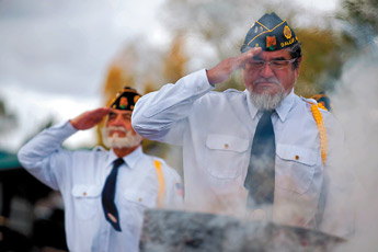 Mike Touchine, of American Legion Post 8, salutes during a flag disposal ceremony at Fox Run Golf Course on Tuesday morning. The ceremony also coincided with a new flag dedication ceremony for the golf course. — © 2009 Gallup Independent / Brian Leddy
