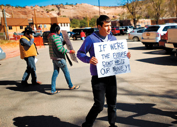 Robert Mazerbo and a few of his friends hold signs outside the Council Chambers in Window Rock after Monday’s special session that put President Joe Shirley on leave. — © 2009 Gallup Independent / Brian Leddy 