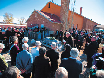 A crowd fills the small graveyard and the area around the church in St. Michaels during the funeral for Sister Marguerite Bartz Saturday. — © 2009 Gallup Independent / Cable Hoover 