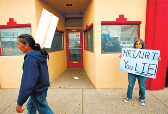 Sofia Martinez, right, and others protest Thursday near Sammy C’s on Coal Avenue while a Hydro Resources Inc. representative attends a chamber of commerce meeting about future uranium mining. — © 2009 Gallup Independent / Adron Gardner