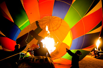 Balloonists warm up their balloon in this Dec. 5, 1008, file photo at Red Rock Park. The 29th Annual Red Rock Balloon Rally kicks off with Friday night's festivities. — © 2009 Gallup Independent / Brian Leddy