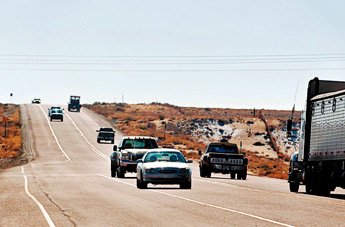 Vehicles drive through short passing lanes Dec. 18 in Sheep Springs. The stretch of highway on U.S. 491 from Shiprock to Tohatchi is expected to resume expansion from two lanes to four at the beginning of next year. Diego James Robles/For The Inedpendent 