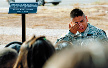 Darryl Talayumptewa weeps during dedication ceremony for his wife, Beulah, at Indian Hills Elementary Dec. 16. Beulah Talayumptewa, who was a teacher at Indian Hills, was killed in August of this year by a DUI driver. "We met in '83 on the cross country team, I think. It seems so long ago," he said. — © 2009 Gallup Independent / Adron Gardner 