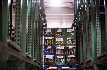 A palette full canned and non-perishable food sits on otherwise empty shelves at the Community Pantry Wednesday. — © 2009 Gallup Independent / Cable Hoover