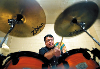 Council Delegate and band member Edmund Yazzie reaches for the crash cymbal during practice in his band Shadow Remain in Coolidge on Monday. — © 2010 Gallup Independent / Adron Gardner