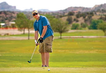 Zach Evans chips onto the putting green at the Fox Run Golf Course on Wednesday morning. &mdash;&nbsp;&copy; 2009 Gallup Independent / Adron Gardner
