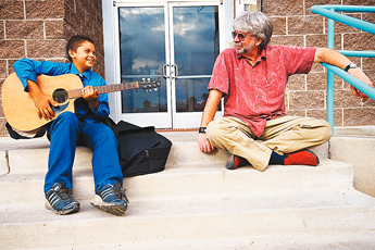Armani Brieno, left, and Wayne Wilcken sit together while they wait for a meeting at Big Brothers Big Sisters office Wednesday. Brieno and Wilcken have been matched together through the program for about 4 months. &mdash;&nbsp;&copy; 2009 Gallup Independent / Cable Hoover