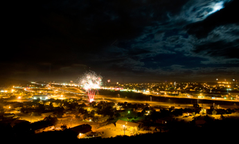 Fireworks and moonlight provide a brilliant display over the city of Gallup during fourth of July celebrations on Saturday evening. Fireworks continued to shoot off over the city late into the night. &mdash;&nbsp;&copy; 2009 Gallup Independent / Brian Leddy 