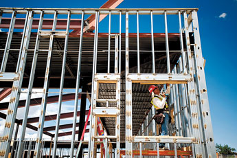 Barry Platero works in a window frame at the McKinley County Public Safety Building on Monday afternoon. &mdash;&nbsp;&copy; 2009 Gallup Independent / Brian Leddy 