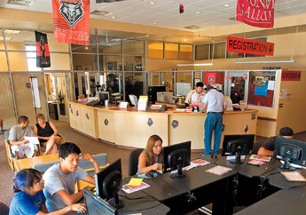 Prospective students look over the electronic course catalogue in the registration office at UNM-Gallup on Wednesday. &mdash;&nbsp;&copy; 2009 Gallup Independent / Adron Gardner 
