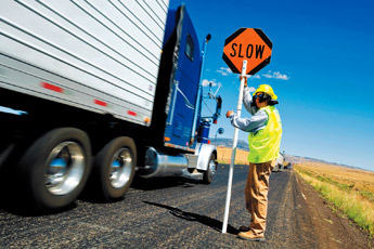 A construction worker who did not wish to give his name flags vehicles on Highway 491 south of Tohatchi on Thursday morning. Traffic remains congested as construction has narrowed the highway down to one lane in one section. &mdash;&nbsp;&copy; 2009 Gallup Independent / Brian Leddy 