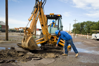Phil Silva, the Distribution Supervisor for the City of Gallup, points out where to dig while looking for a water main break on Second Street near the railroad tracks on Thursday. The break caused flooding in the area of Second and Thirds Streets, but was under control and replaced quickly. &mdash;&nbsp;&copy; 2009 Gallup Independent / Brian Leddy