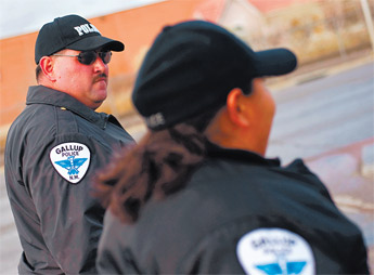 Gallup Police officers Travis Simshauser and Valerie Wilson move east along Historic Route 66 while on the department&rsquo;s new downtown foot patrol Friday. &mdash;&nbsp;&copy; 2009 Gallup Independent / Cable Hoover 